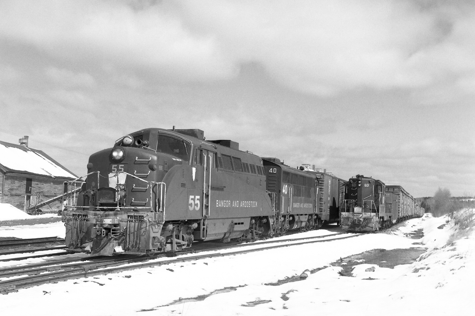 BAR 55 & 40 arrive at Ashland, ME with train #212 on 4/7/1973 BAR 55 & 40 arrive at Ashland, ME with train #212 on 4/7/1973
