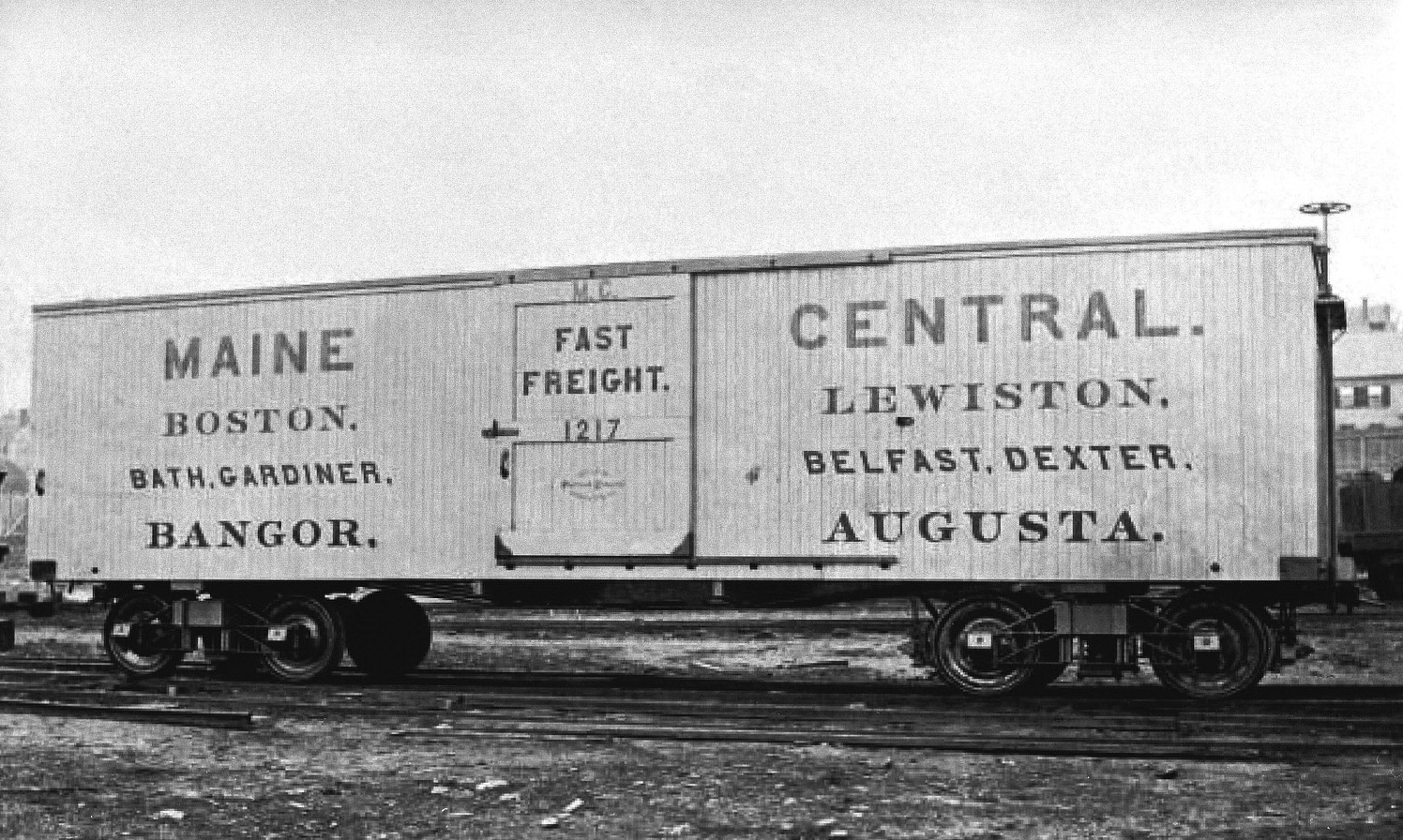Maine Central Railroad wooden boxcar #1217. This image is grainey but the image is rare. This photo will print with a white border along the top and bottom. (8x10) Maine Central Railroad wooden boxcar #1217. This image is grainey but the image is rare. This photo will print with a white border along the top and bottom. (8x10)