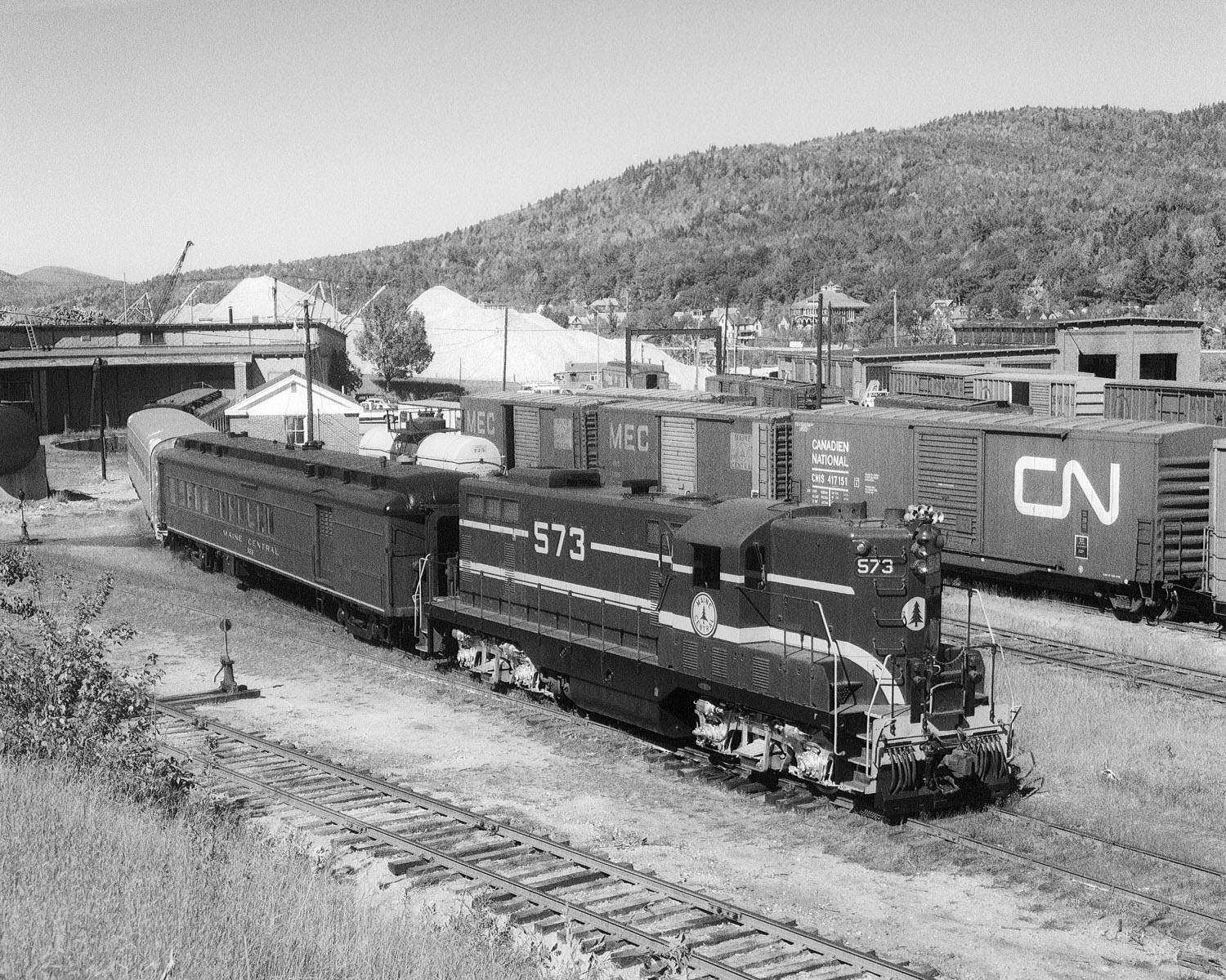 Maine Central GP7 #573 on a inspection train at Rumford, Maine with cars #322, 390, & 333 during September 1977. (8x10) Maine Central GP7 #573 on a inspection train at Rumford, Maine with cars #322, 390, & 333 during September 1977. (8x10)