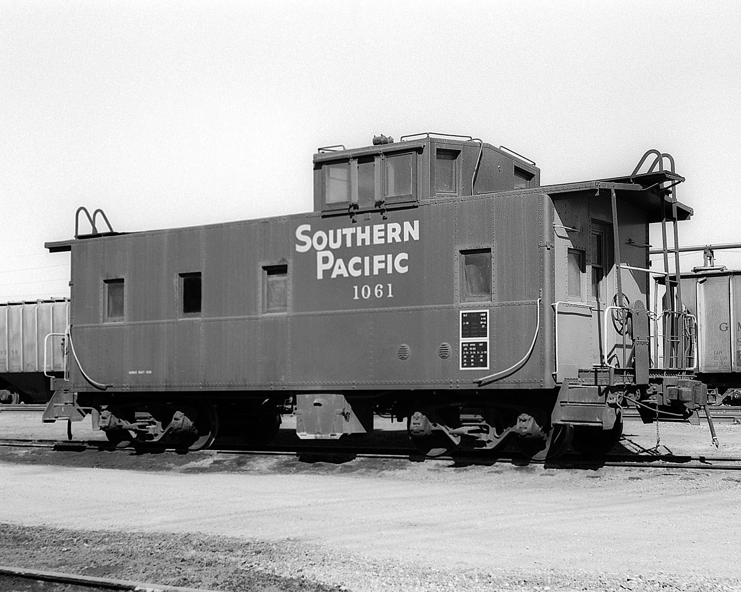 Southern Pacific Caboose #1061 at El Centro, CA on 2/18/1978. Built 3/1940. (8x10) Southern Pacific Caboose #1061 at El Centro, CA on 2/18/1978. Built 3/1940. (8x10)