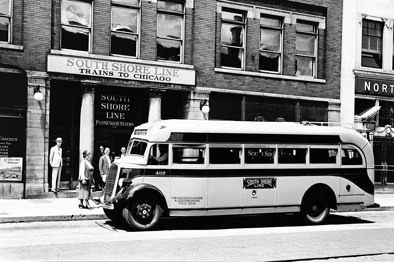 Chicago, South Shore & South Bend Railroad Bus #407 picking up and discharging passengers. Date and location are unknown. On the front of the bus overhead it reads "Benton Harbor" and "St. Joseph". (8x12) Chicago, South Shore & South Bend Railroad Bus #407 picking up and discharging passengers. Date and location are unknown. On the front of the bus overhead it reads "Benton Harbor" and "St. Joseph". (8x12)