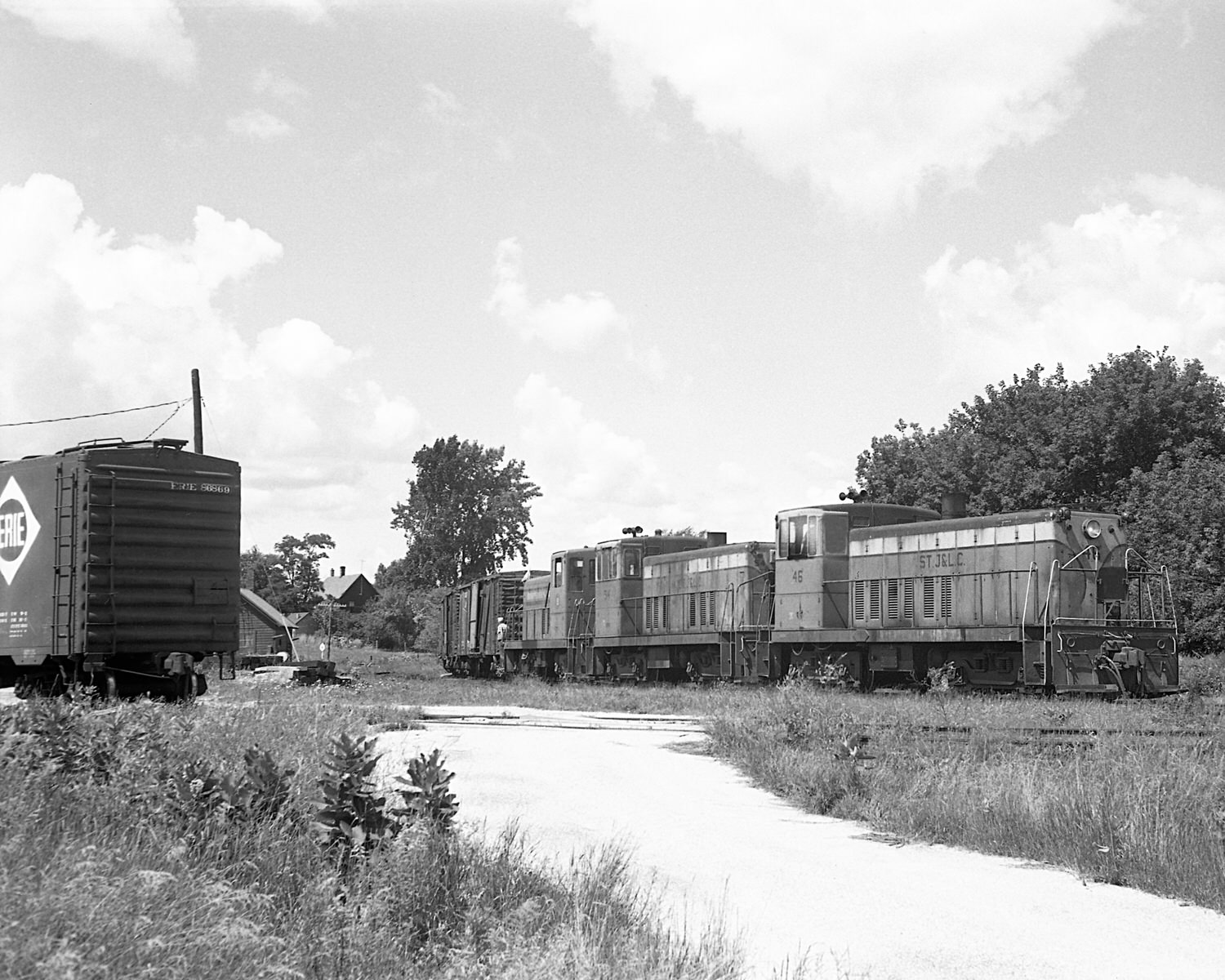 St. Johnsbury & Lamoille County Railroad 70 tonners #46, 54 & Montpelier & Barre #19 on train #74 switching Swanton, VT yard during the mid to late 60's. (8x10) St. Johnsbury & Lamoille County Railroad 70 tonners #46, 54 & Montpelier & Barre #19 on train #74 switching Swanton, VT yard during the mid to late 60's. (8x10)